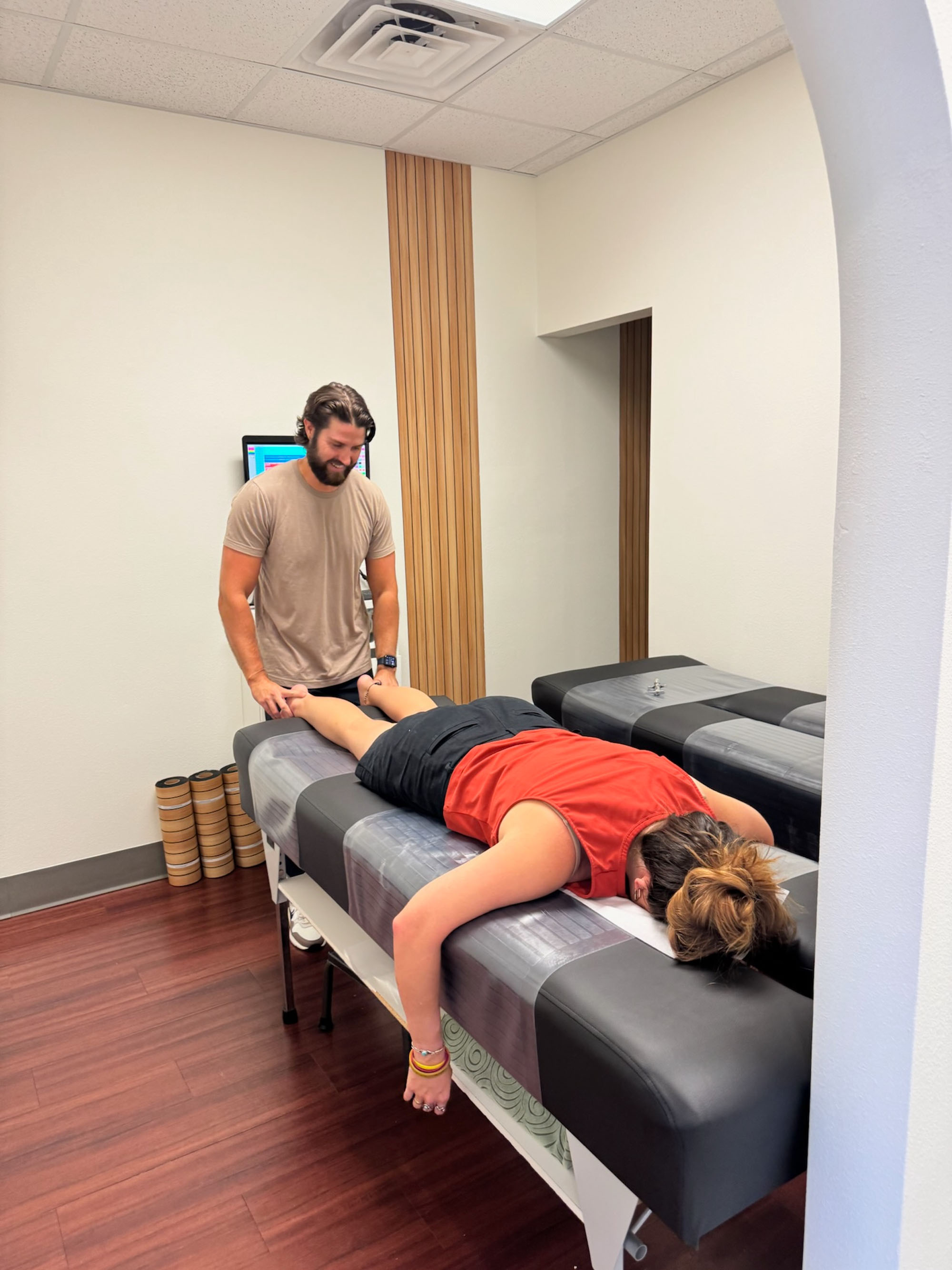 Dr. Logan Swaim performs a focused adjustment at The Roots.