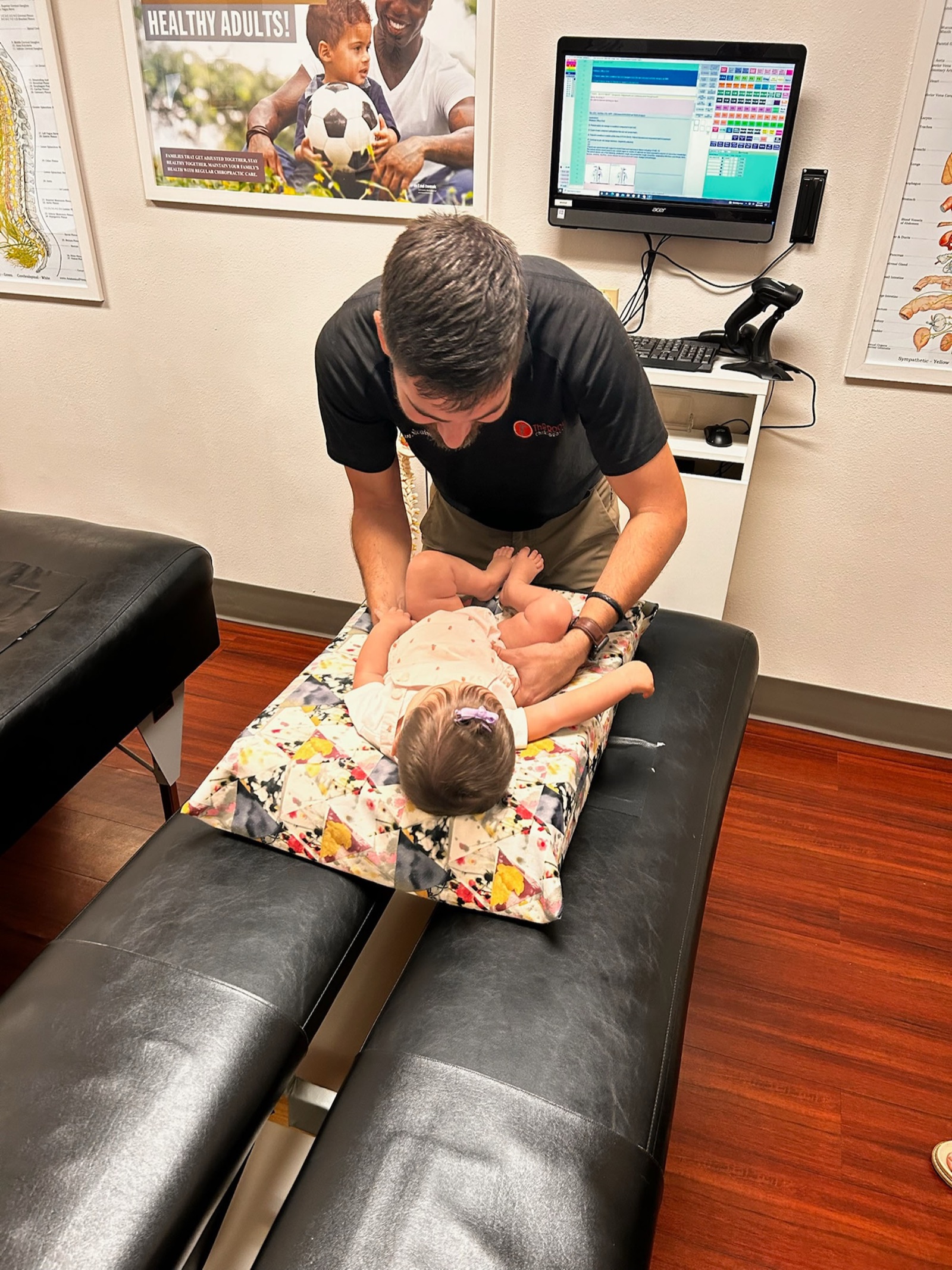 Dr. Logan Swaim performs a focused newborn adjustment.