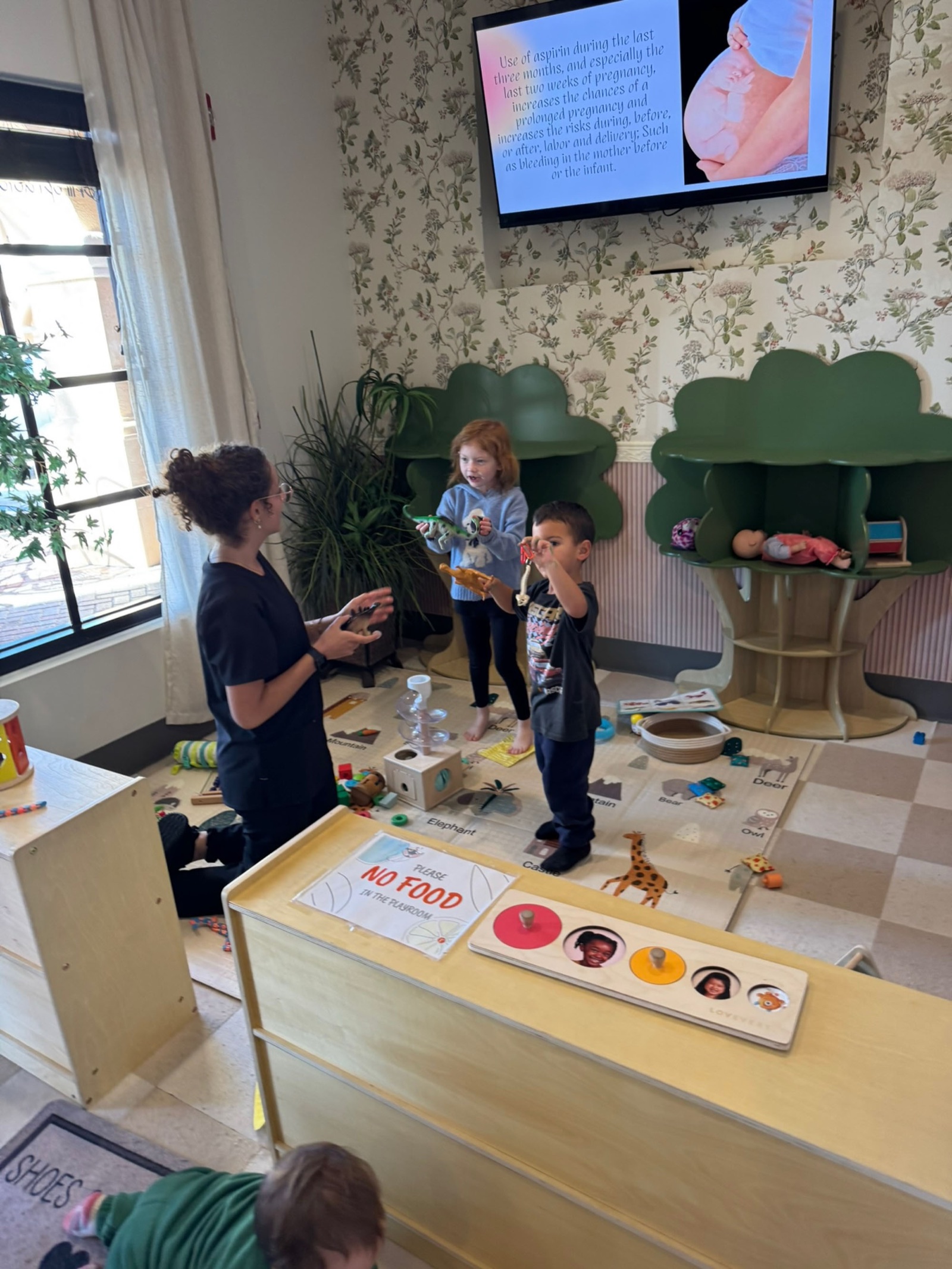 Yohanna with kids during a clinic teaching moment.